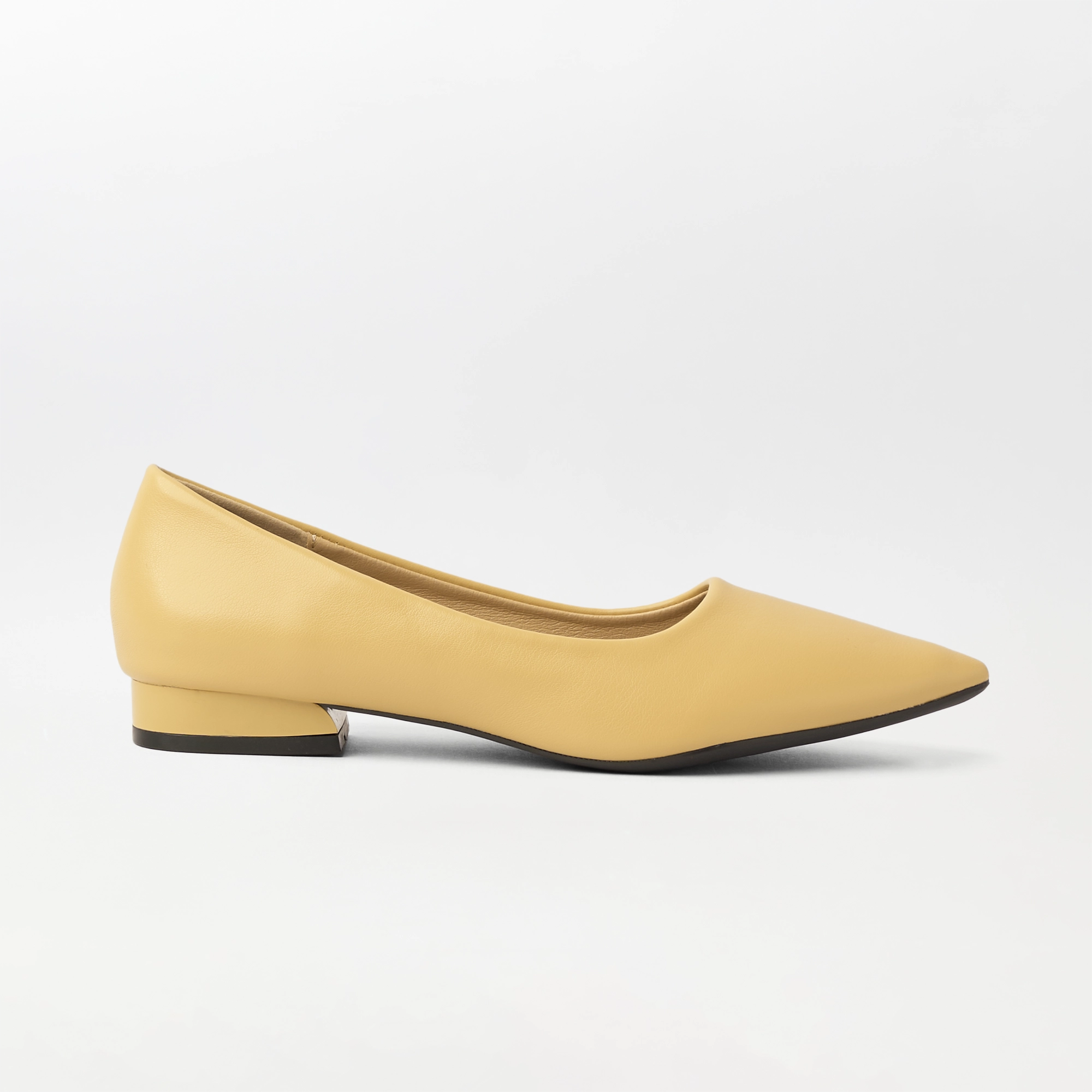 A single pale yellow pointed-toe flat shoe with a low block heel, shown in a side profile on a clean white background.